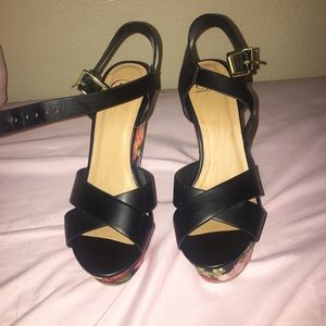 black leather heels with floral bottom